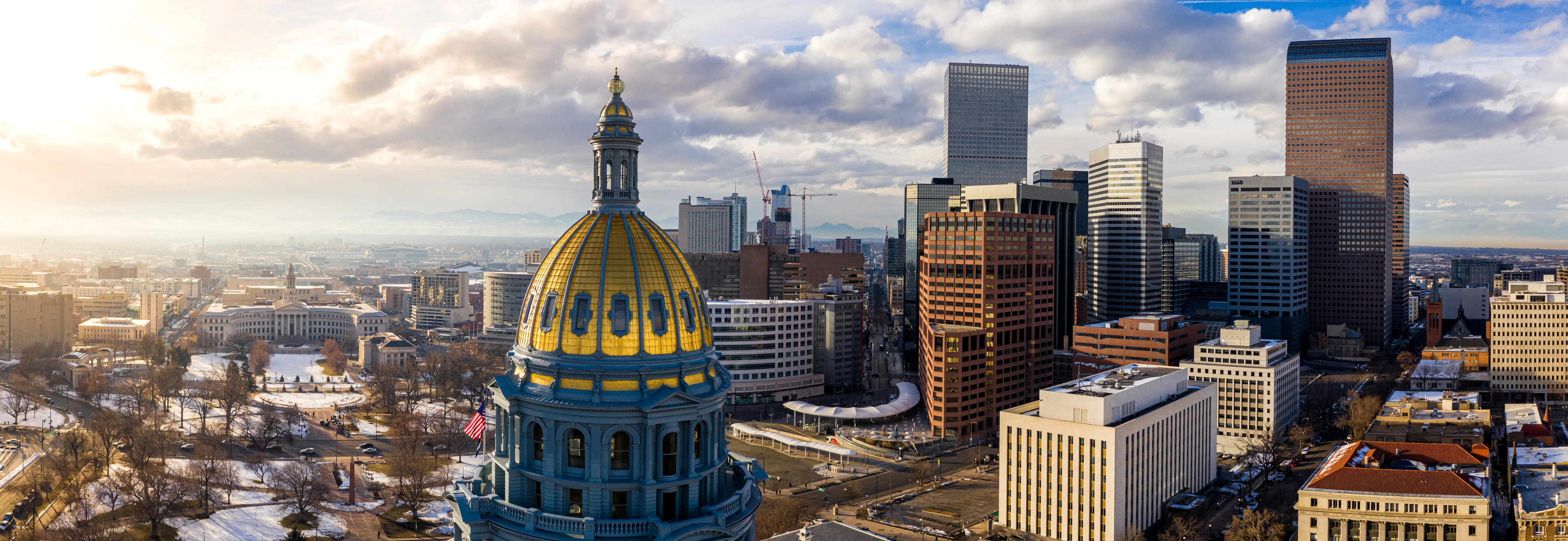 Denver Capitol Building and downtown Denver skyline.